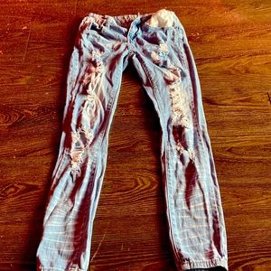Gray/Blue VIP Jeans with with Ripping designs.